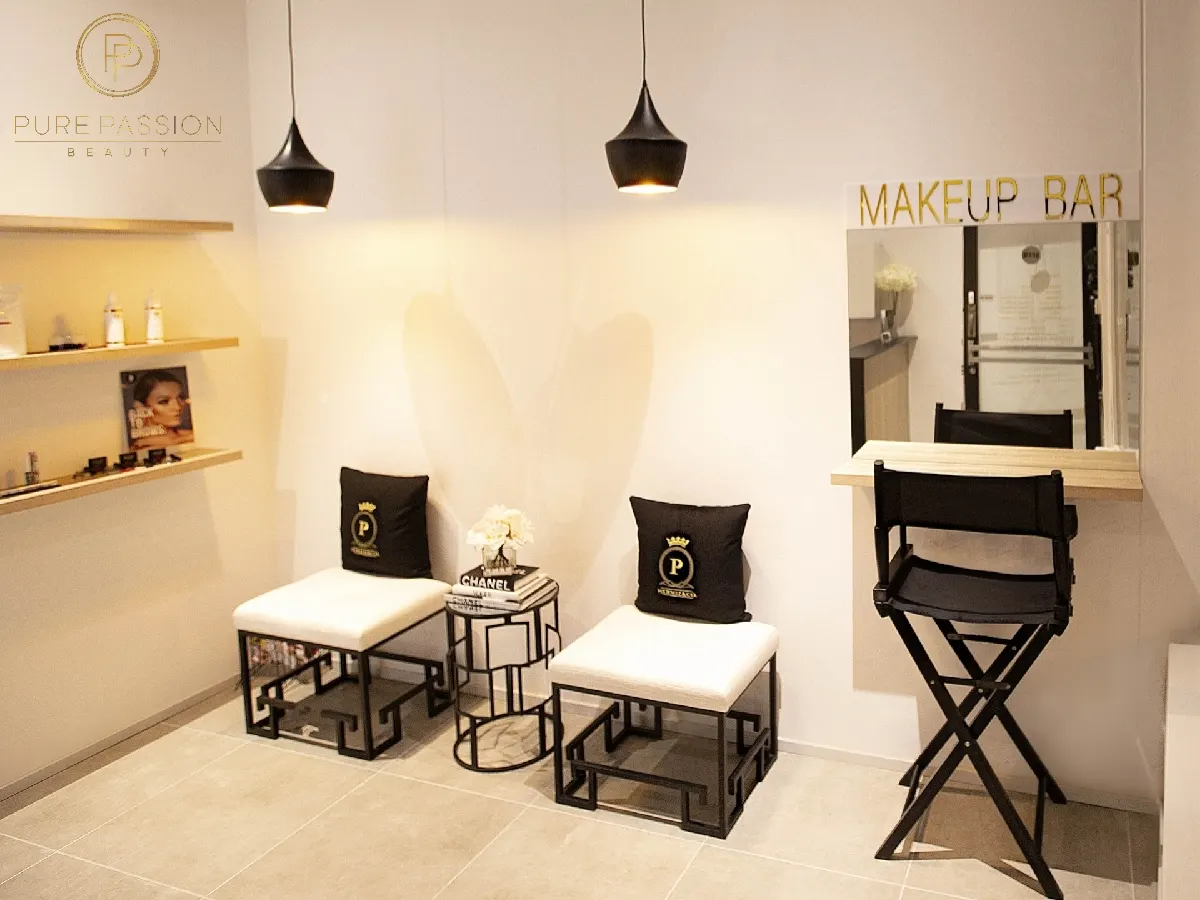 The makeup bar with director chairs and pendant lights